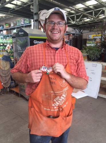 White man in Home Depot uniform poses with name tag