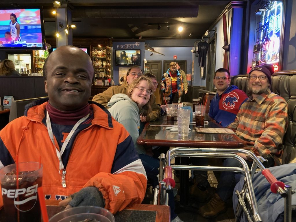 Community Choices members smiling for photo at restaurant